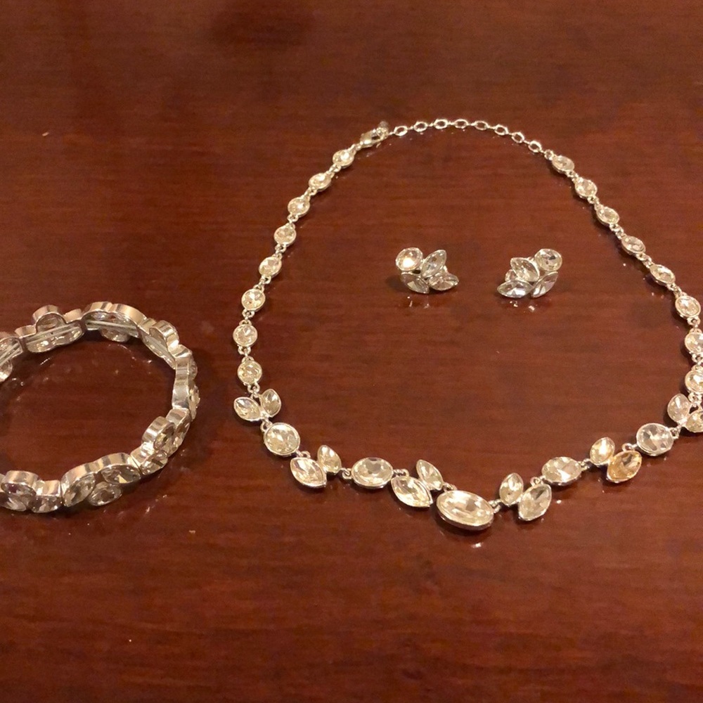Matching necklace, earring, and bracelet set.